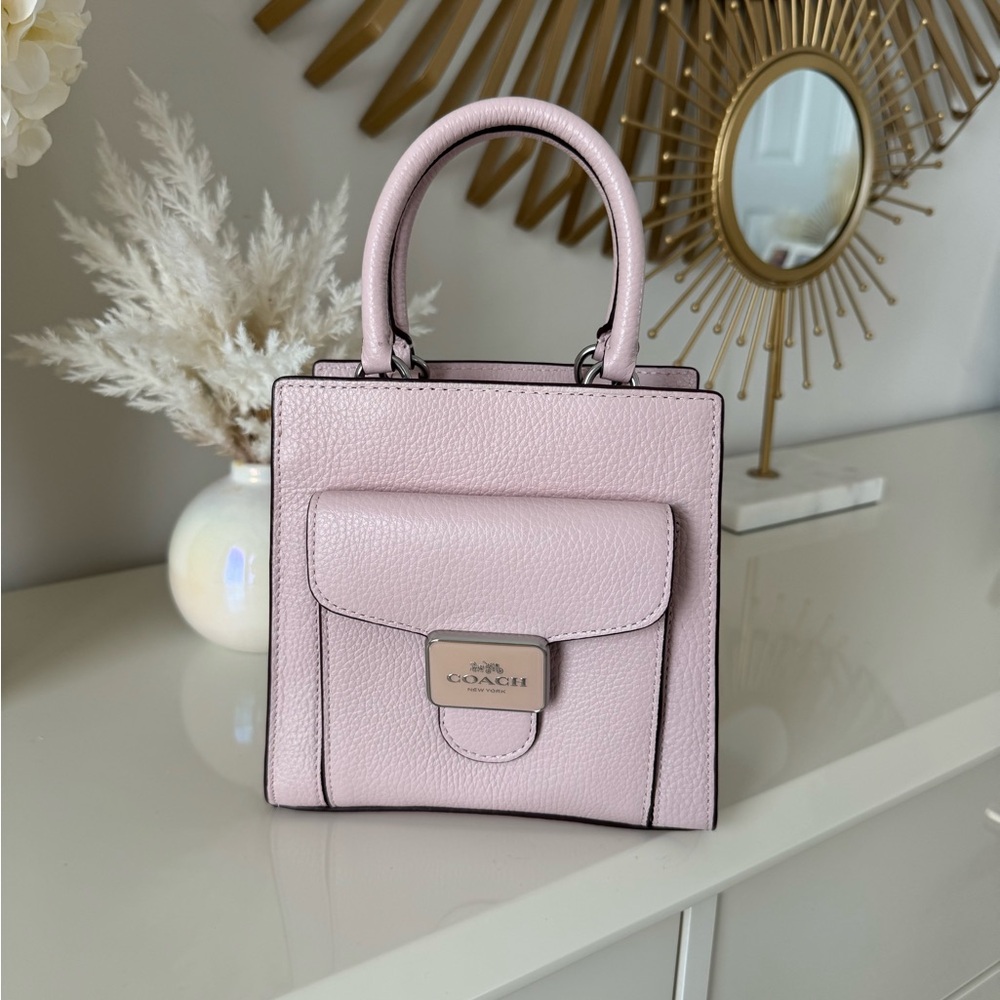 Coach Light Pink Leather 	
Mini Pepper Crossbody